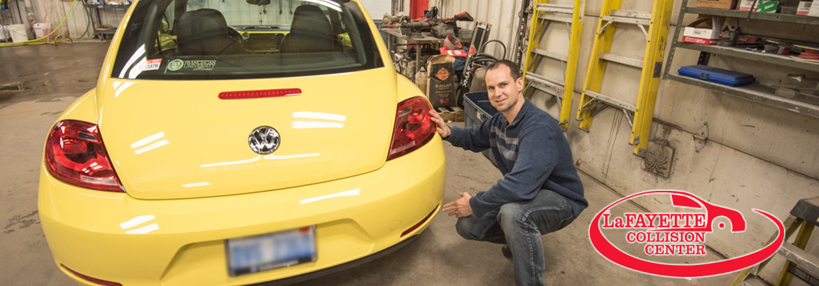 Nick showing off his work on this Yellow VW Beatle